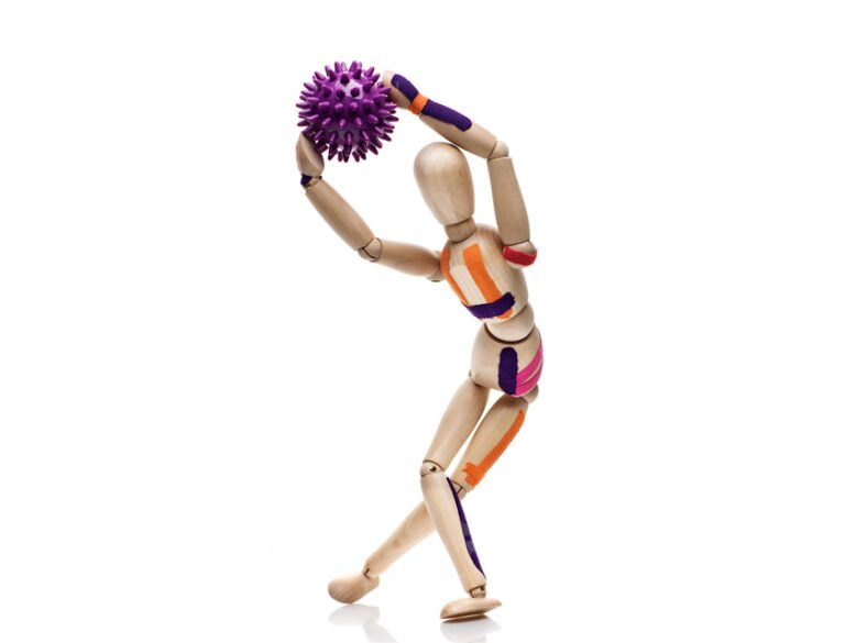 Kinesiology taping. Kinesiology tape on a wooden dummy